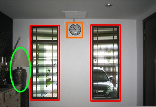 One Wall Clock in the centre of 2 Windows.....