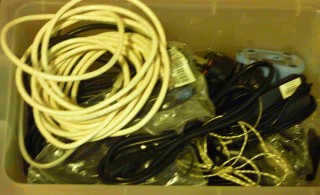 N (a) was filled with Bundles of unwanted wire obstructed in a cabinet in a room